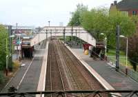Sunday morning view over Shettleston station towards Glasgow city centre, early on 13 May 2007. The station footbridge here is heavily used, serving rail passengers, pedestrians and shoppers using the large Superstore on the south side of the line.<br><br>[John Furnevel /05/2007]