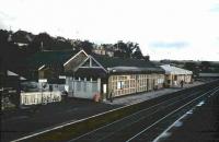 Cant say I really remember Inverkeithing like this but here it is in August 1985... the two down buildings must have coexisted for a while, albeit the awning had been removed from the older one. With the addition of the station house and the news kiosk things look fairly crowded compared with todays situation.<br><br>[David Panton /08/1985]