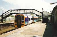 Aberdeen - Inverness service formed by 158 730 stops at Inverurie on a sunny day in May 1999.<br><br>[David Panton /05/1999]