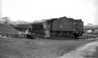 V2 60919 on the turntable at Ferryhill shed in the 1960s with A4 Pacific no 60007 <I>Sir Nigel Gresley</I> standing in the sidings beyond. [Thanks to all, including the GNSRA.]  <br><br>[Robin Barbour Collection (Courtesy Bruce McCartney) //]