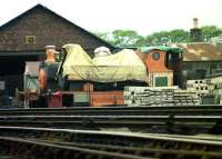 The 3 ex-Aberdeen Gasworks steam locomotives grounded at Ferryhill shed in 1974 within the compound being used at that time by the Aberdeen Corporation Parks Department. Nearest the camera is No 3 undergoing restoration work. This locomotive is now a permanent exhibit outside the Grampian Transport Museum, Alford. [see image 12565] <br><br>[John McIntyre /04/1974]