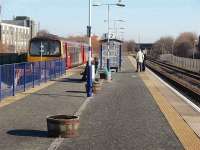 144006 stands at Morecambe, opened in 1994 to replace Morecambe Promenade and built on the site of the first (1850 to 1907) station with the 1244 service to Leeds on 12 February. On the right is the single line to Heysham and its little used run around loop. (The junction for Heysham lies just beyond the overbridge.)<br><br>[Mark Bartlett 12/02/2008]