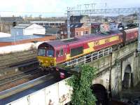 EWS 66163 brings coal empties west through Gilmour Street on 22 February on their way back to Hunterston. <br><br>[Graham Morgan 22/02/2008]