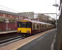 A service for Dalmuir via Yoker arrives at Bridgeton on 23 February formed by 318 267.<br><br>[David Panton 23/02/2008]