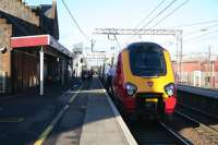 Final checks at Lockerbie on 6 February before moving off with the 1311 CrossCountry service to Edinburgh Waverley. The newly commissioned footbridge can be seen towards the north end of the plaform.<br><br>[John Furnevel 06/02/2008]