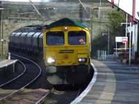 Freightliner Heavy Haul 66583 thunders through Johnstone on 27 February as it heads for Hunterston with an empty coal train.<br><br>[Graham Morgan 27/02/2008]