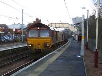 EWS 66068 passing south through Johnstone with empty coal hoppers for Hunterston on 27 February. <br><br>[Graham Morgan 27/02/2008]