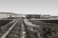 What is obviously a very important van heading along the Crombie branch towards Elbowend Junction on 30 April 1990. 26010 (destined for the Whitrope project) and 20211 provide the power.<br><br>[Bill Roberton 30/04/1990]