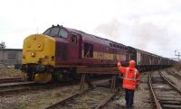 A final wave to the driver of 37422 as he takes his train away from Elgin on 18 February 2008 hauling seed potato traffic bound for Ely. (Photographed looking back along the line from Elgin East yard.)<br><br>[Mick Golightly 18/02/2008]