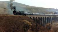 Class 9F 2-10-0 92220 <I>Evening Star</I> takes a northbound railtour over Arten Gill Viaduct circa 1984.<br><br>[Colin Alexander //1984]