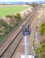 Looking north towards Montrose along the single line section from Usan. There is a new uncompleted colour light signal closer than the existing semaphore. <br><br>[Brian Forbes 02/03/2008]