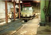 NCB electric locomotive E2 (Siemens 455 of 1909) sits at the rear of the shed at Westoe in 1983 alongside a Barclay diesel 60 years her junior. The locomotive was later preserved at Beamish [see image 43656] <br><br>[Colin Alexander //1983]