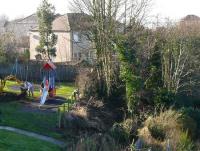 The overgrown track at Wormit, overlooked by Tay Bridge South cabin (top right), seen 40 years after the Tayport Branch closed. New swings stand on the spot where a fatal accident occurred following a derailment here in 1955.<br><br>[Brian Forbes /02/2008]