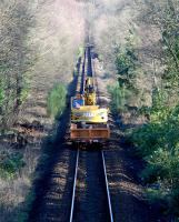 Road/rail crane heading from High Balernock L.C. back to operations near the former Faslane Junction. The crane is passing the site of the demolished Shandon station.<br><br>[Ewan Crawford 04/03/2008]