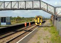 First station after leaving the Severn Tunnel on the Cardiff - Bristol route is Pilning, seen here with a PW squad giving way to a 158 on 17 August 2007.<br><br>[Peter Todd 17/08/2007]