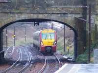 334028 passing the mile post marker showing 10 miles from Glasgow as it approaches Johnstone station on 5th March<br><br>[Graham Morgan 05/03/2008]