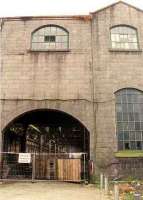 View south of the imposing exterior of Aberdeen Guild St goods shed, built on the site of Guild St passenger station, which was replaced by the present station. The shed was demolished and the yard cleared for the Union Square development.<br><br>[Ewan Crawford /08/1999]