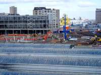 Oil industry support vessels can be seen berthed in the harbour area beyond Market Street on 5 March in this view looking east over the roof of Aberdeen station. With rail freight operations at Guild Street yard having now been taken over by Craiginches and Raiths Farm, redevelopment of this prime location is well underway.  <br><br>[Andy Furnevel 05/03/2008]