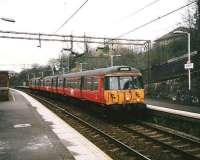 303 016 arrives at Kirkhill in March 1998 with a service for Newton.<br><br>[David Panton /03/1998]