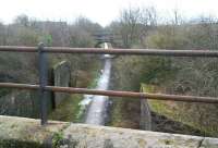 View south from the long closed road bridge in Fishcross on 28 February 2008, looking along the Devon Valley route towards Alloa. The other bridge carries the B9140 and beyond is the site of Sauchie station. The old abutments midway between the bridges supported the Alloa wagonway route into Sauchie Colliery and the Devon Ironworks off to the right (also served by the old road bridge from which the picture was taken).<br><br>[John Furnevel 28/02/2008]