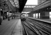 A class 24 with the empty stock of the Royal Train alongside the crossover at Aberdeen platform 6 in May 1973.<br><br>[John McIntyre 26/05/1973]