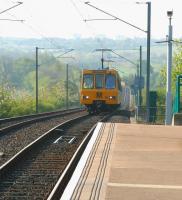 A Tyne & Wear Metro service heading for Newcastle Airport in May 2006 on the climb west from Bank Foot up to Callerton Parkway.<br><br>[John Furnevel 10/05/2006]