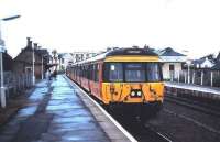 303 044 waits at Lanark in September 1986 with a Dalmuir train.<br><br>[David Panton /09/1986]