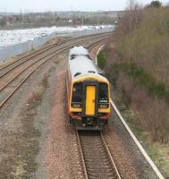 A mid afternoon Edinburgh - Bathgate service, formed by South West Trains liveried 158786, approaching its destination on 11 March 2008, with the STVA car terminal filled to overflowing. Photographed from the soon-to-be-demolished Rennie's Bridge.<br><br>[John Furnevel 11/03/2008]