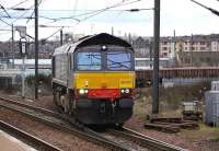 After leaving the <I>sub</I> at Craiglockhart Jct on 18 March, DRS 66423 comes off the spur to join the Edinburgh - Carstairs line at Slateford Jct and is about to run through the station with a train of EWS ballast trucks.<br><br>[Bill Roberton 18/03/2008]