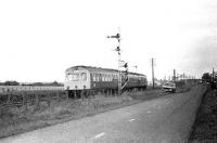 A DMU for North Berwick photographed near Drem in 1977 with the branch signal at clear in the distance. <br><br>[Robin Barbour Collection (Courtesy Bruce McCartney) //1977]