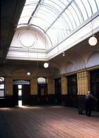 Cleaner at work in the old booking hall at Elgin East in 1977.<br><br>[Ian Dinmore //1977]