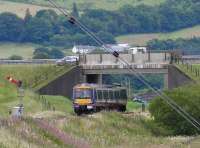 Express class 170 heading north to Aberdeen passing under the A9 trunk road.<br><br>[Brian Forbes //2007]