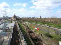 Recovered track panels from the now closed Stratford - North Woolwich section of the North London Line standing alongside the 1994 Docklands Light Railway station at Prince Regent on 21 March 2008. View west towards Canning Town with the Victoria and Albert Docks behind the camera.<br>
<br>
<br><br>[Michael Gibb 21/03/2008]