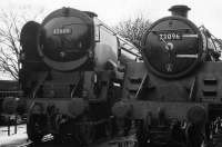 Merchant Navy class locomotive 35005 <I>Canadian Pacific</I> stands alongside BR standard class 5 73096, pictured on the Mid Hants Railway on 11 March 2008<br><br>[Peter Todd 11/03/2008]