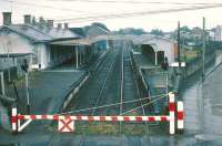 Looking over the station at Tuam, County Galway, from the level crossing on a wet day in 1988.<br><br>[Bill Roberton //1988]