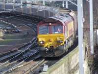 EWS 66163 approaching Paisley Gilmour Street on 22nd February with an empty coal train bound for Hunterston <br><br>[Graham Morgan 22/02/2008]