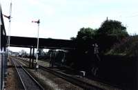 Photograph taken from a train passing Elderslie West Junction on 28th July 1975. All that remained of the station at this time was the foot bridge, now demolished. Where the trucks are stabled next to No.1 SB is now part of the  National Cycle Network. <br><br>[Graham Morgan Collection 28/07/1975]