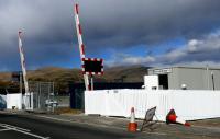 Showers threaten Blackgrange crossing on the new Alloa Line. This crossing is mainly used in conjunction with numerous large whisky bonded warehouses to rear of camera.<br><br>[Brian Forbes 24/03/2008]