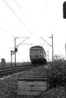 A westbound pair of Class 303s with unit 043 leading and unit 001 in the rear near Cardross in March 1974. [See image 29171]<br><br>[John McIntyre /03/1974]