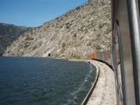 Kyle of Lochalsh train? No - but there is an English Electric loco at the head of three coaches heading for Porto alongside the Douro. The train is about to enter the tunnel that will take it down past the river dam. These Portuguese 1400 Class locos are very similar to the EE Class 20s and sound wonderful as they pass through the valley calling at every station. <br><br>[Mark Bartlett 20/03/2008]