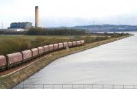 EWS 66083 hauls a coal train from Hunterston Import Terminal east along the Forth under the Kincardine Bridge and out towards Longannet Point on 5 April 2008. On reaching Longannet power station it will discharge the first shipment of coal to arrive via the newly reopened rail link through Alloa.<br><br>[John Furnevel 05/04/2008]