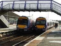 Crossing at Montrose, with 170 433 bound for Edinburgh Waverley and 170 419 heading north to Aberdeen.<br><br>[John Gray 26/03/2008]