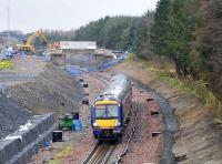 The 1255 ex Bathgate approaching the former Bangour Junction on 7 March 2008. The dressing stone on the overbridge in the background is the original, having been sandblasted and refitted. <br><br>[James Young 07/03/2008]