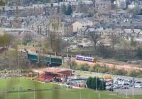 Running past the Stirling County RFC grounds, a First ScotRail 158 is about to cross the Forth on the NB viaduct on 9 April 2008. The Caledonian viaduct carrying the Stirling - Perth line stands alongside. The 158 is on a return familiarisation working along the recently reopened S&DR route from Alloa.<br><br>[John Furnevel 09/04/2008]