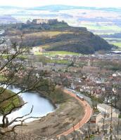 View across the meandering upper reaches of the River Forth towards Stirling Castle on 9 April 2008 as a First ScotRail 158 heads west towards Stirling station along the line from Alloa on a driver training run a month prior to the recommencement of passenger services.<br><br>[John Furnevel 09/04/2008]