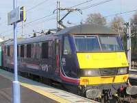 Driver nodded off perhaps....? The unusual sight of EWS 90021 in First ScotRail <I>Caledonian Sleeper</I> livery arriving with a train at Norwich on 7 April 2008.<br><br>[Ian Dinmore 07/04/2008]