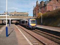 170 402 heads south from Arbroath on 2 April 2008. The impressive station frontage can be seen on the West Port in the background.<br><br>[David Panton 02/04/2008]