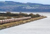EWS 66083 with a coal train from Hunterston Import Terminal approaches a signal check near the extremity of Longannet Point on 5 April 2008, just prior to turning onto the <I>west arrivals</I> line into Longannet power station. <br><br>[John Furnevel 05/04/2008]