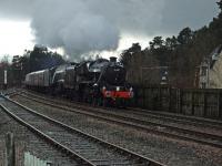 45407 and 60009 approach Aviemore from the south. A special thanks to the gent who loaned me a step ladder and the lady who held the brolly while I took the picture.<br><br>[John Gray 13/04/2008]