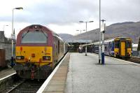 View towards the buffer stops at Fort William on 7 April 2008, with 67004 at the head of the 1950 sleeper to Euston and 156 493 about to leave with the 1737 service to Glasgow Queen Street. <br><br>[Bill Roberton 07/04/2008]